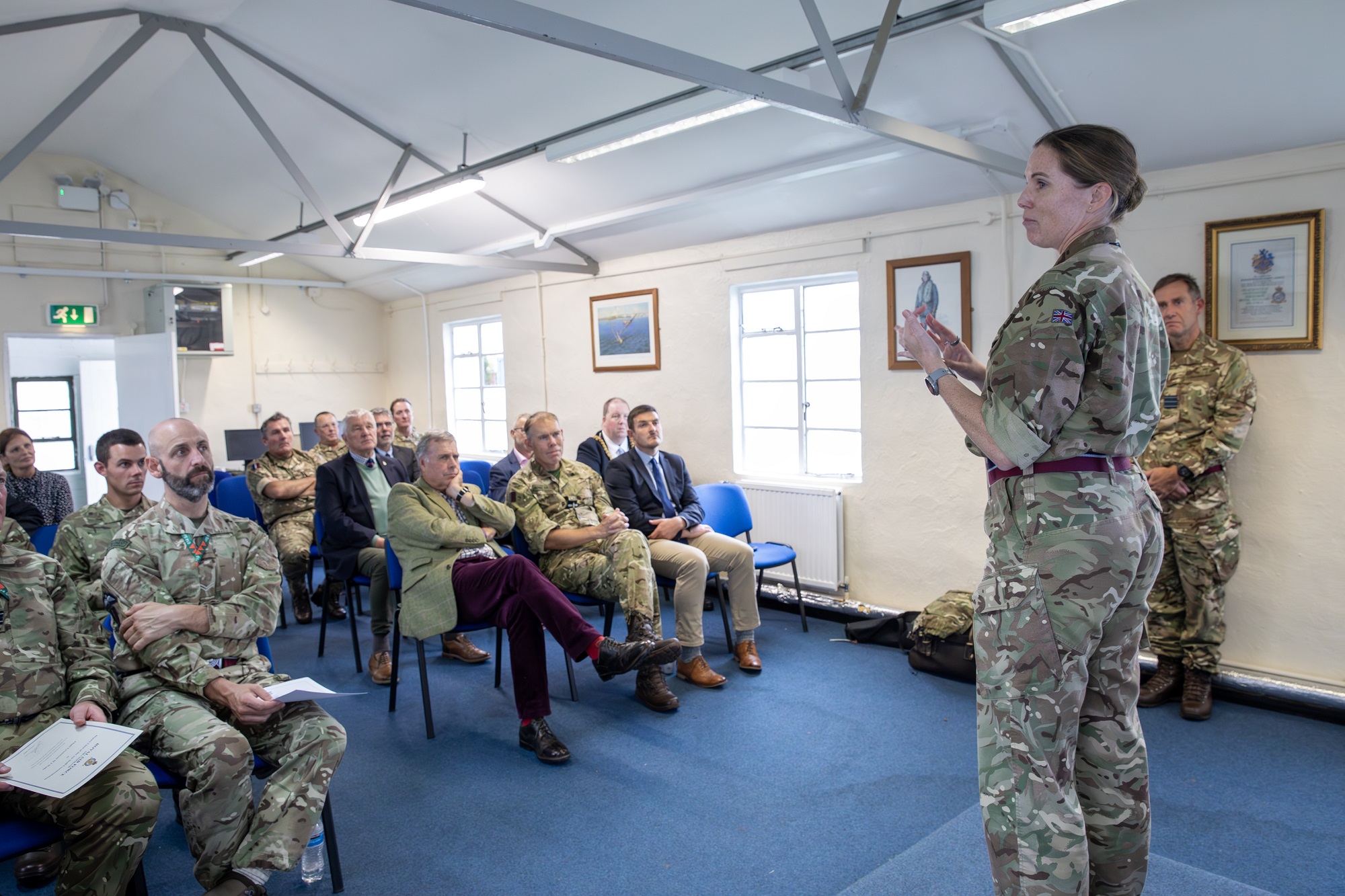 Group Captain Louise Henton addresses visitors to 614 Squadron at Brize Norton after awarding a Deputy Chief of the Air Staff and an Air Officer Commanding 2 Group commendations, and a Bar to a Volunteer Reserve Service Medal.
